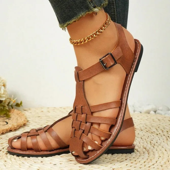 Dark brown women's vintage weave roman sandals with closed toe and buckle fastening on a soft rubber sole.