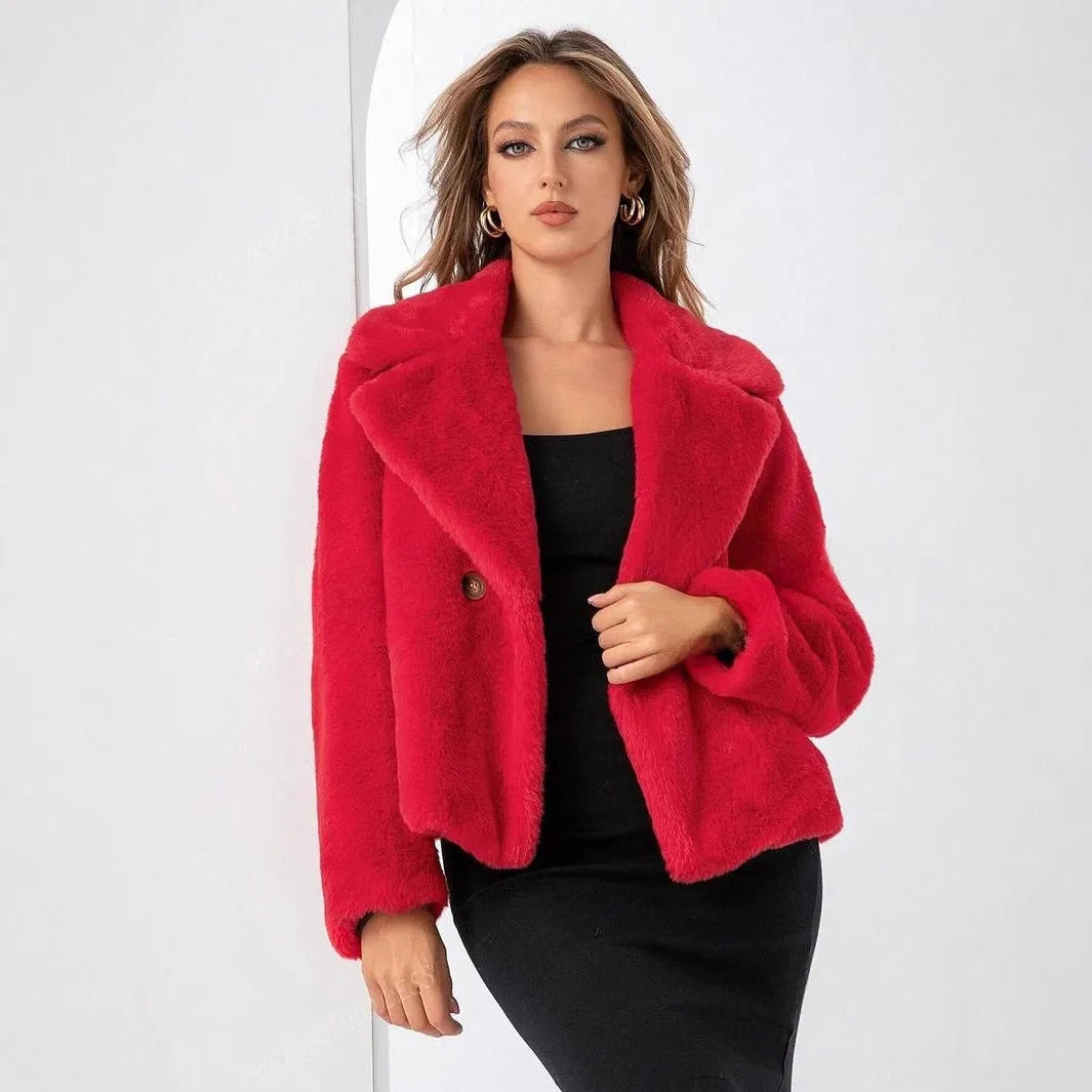 Short loose women's coat in rose red artificial faux fur with regular sleeves.